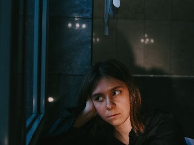 Macro shot of light reflecting in a dark room.